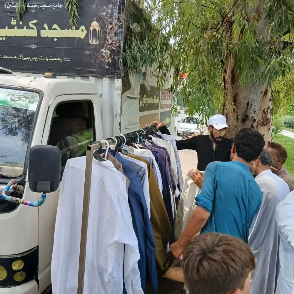 Masjid Container distributing clothing during mobile outreach