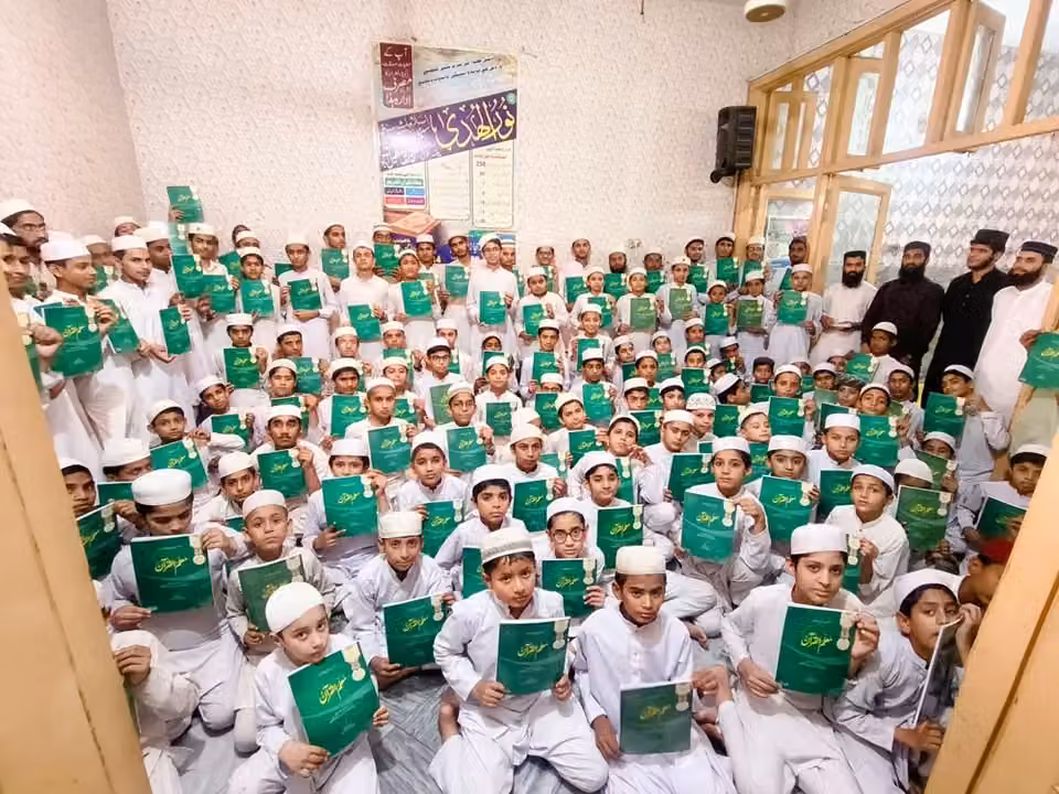 Students of Masjid Quran Academy with Quran learning books